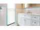 Bright bathroom with white cabinets and marble countertop at 2054 Pennsylvania Ave, Englewood, FL 34224