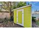 Bright yellow shed with white trim in a private backyard setting at 2661 45Th S St, Gulfport, FL 33711