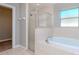 Bathroom showcases a shower and soaking tub combo and a window offering natural light at 3206 Duchess Ct, Plant City, FL 33565