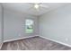 Empty bedroom with plush carpeting, ceiling fan, and window with natural light at 3206 Duchess Ct, Plant City, FL 33565