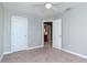 Carpeted bedroom with ceiling fan, natural light and bathroom access at 3206 Duchess Ct, Plant City, FL 33565