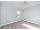 Cozy bedroom with carpet, window, and soothing, neutral wall color at 3206 Duchess Ct, Plant City, FL 33565