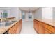 Bright dining area featuring granite counter, stainless sink, and access to front room at 3206 Duchess Ct, Plant City, FL 33565