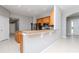 Spacious kitchen featuring stainless steel appliances, wooden cabinetry, and granite countertops at 3206 Duchess Ct, Plant City, FL 33565