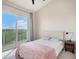 Inviting bedroom with a balcony offering peaceful green treetop views at 3266 Mangrove Point Dr, Ruskin, FL 33570