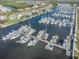 Aerial view of a marina with many boats docked, surrounded by waterfront homes at 3266 Mangrove Point Dr, Ruskin, FL 33570