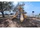 Community playground with slides, swings, and play structures and a basketball court and a view of the ocean at 3266 Mangrove Point Dr, Ruskin, FL 33570