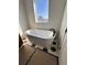 Freestanding white bathtub beneath bright window on hexagon tile floor at 3404 S Omar Ave, Tampa, FL 33629