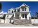 Beautiful two-story home featuring stone accents, white trim, and a welcoming front porch at 3404 S Omar Ave, Tampa, FL 33629