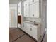 New kitchen featuring all-white cabinets and drawers with black hardware and marble backsplash at 3404 S Omar Ave, Tampa, FL 33629