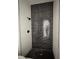 Shower featuring dark tile and black fixtures at 3404 S Omar Ave, Tampa, FL 33629