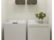 The laundry room area boasts a side by side washer and dryer at 36240 Risa Michele St, Zephyrhills, FL 33541