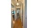 Hallway with hardwood floors leading into the bedroom at 3745 100Th N Pl # 3745, Pinellas Park, FL 33782