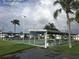 Outdoor shuffleboard courts feature shaded benches for relaxing and enjoying the recreational activities at 3745 100Th N Pl # 3745, Pinellas Park, FL 33782