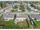 This aerial view shows a single-Gathering home with a fenced backyard in a quiet neighborhood at 3934 Moog Rd, Holiday, FL 34691