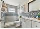 Updated bathroom boasts a sleek glass shower and white vanity, creating a clean and contemporary space at 3934 Moog Rd, Holiday, FL 34691