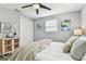 Bedroom view with a closet, ceiling fan, and decor at 3934 Moog Rd, Holiday, FL 34691