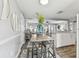 Dining area adjacent to living area and kitchen with an island bar top at 3934 Moog Rd, Holiday, FL 34691