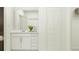 Clean bathroom featuring a modern vanity, stylish mirror, and closet with extra storage at 10248 Purple Leaf Ct, Riverview, FL 33578