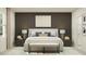 Elegant bedroom featuring a dark accent wall, stylish lighting, and an upholstered bench at 10248 Purple Leaf Ct, Riverview, FL 33578