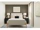 Comfortable bedroom featuring neutral tones, stylish lamps, and a decorative area rug at 10248 Purple Leaf Ct, Riverview, FL 33578