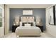 Comfortable bedroom featuring a neutral color palette, stylish lamps, and decorative artwork at 10248 Purple Leaf Ct, Riverview, FL 33578