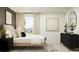 Inviting bedroom featuring a well-lit window, sleek decor, and an accent wall at 10248 Purple Leaf Ct, Riverview, FL 33578