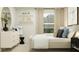 Bright bedroom featuring natural light, modern decor, a dresser, and decorative shelves at 10248 Purple Leaf Ct, Riverview, FL 33578