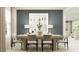 Dining room with lots of light, stylish table decor, and view to the staircase at 10248 Purple Leaf Ct, Riverview, FL 33578
