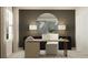 Modern office with a stylish wood desk, comfortable chair, and a circular mirror over a credenza at 10248 Purple Leaf Ct, Riverview, FL 33578