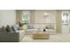 Comfortable living room with stylish sectional, natural light, and decorative accents at 10248 Purple Leaf Ct, Riverview, FL 33578