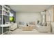 Open-concept living room with a modern desk, comfortable seating, and natural light at 10248 Purple Leaf Ct, Riverview, FL 33578