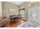 Elegant dining area with wood floors, chandelier lighting, and bright window with decorative curtain at 108 Rosana Dr, Brandon, FL 33511