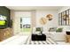 Cozy living room featuring a comfortable white sectional sofa and sliding glass doors to the yard at 12718 Crystal Jade Way, Parrish, FL 34219