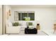 Bright living room featuring a white sectional sofa and stylish decor at 12718 Crystal Jade Way, Parrish, FL 34219