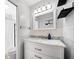 Bathroom with a white vanity, subway tile backsplash, and a shower at 1489 77Th N Ave, St Petersburg, FL 33702