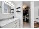 Bathroom featuring a vanity with marble countertop and walk-in closet at 1489 77Th N Ave, St Petersburg, FL 33702