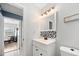 Bathroom with mosaic tile backsplash, modern vanity, and contemporary fixtures at 1489 77Th N Ave, St Petersburg, FL 33702