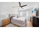 Bright bedroom featuring a ceiling fan and TV at 1489 77Th N Ave, St Petersburg, FL 33702
