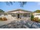 Inviting single-story house with a quaint porch and modern architectural details at 1489 77Th N Ave, St Petersburg, FL 33702