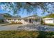 Charming single-story home featuring a lovely front porch and well-maintained landscaping at 1489 77Th N Ave, St Petersburg, FL 33702