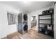 Modern laundry room features stacked washer/dryer and shelving at 1489 77Th N Ave, St Petersburg, FL 33702