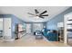 Comfortable living room with a large television and opening to the other rooms at 1489 77Th N Ave, St Petersburg, FL 33702
