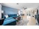 Open living space with a large sectional couch and bar-style seating leading to the outdoor area at 1489 77Th N Ave, St Petersburg, FL 33702