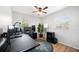 Office with two windows, ceiling fan, hardwood floors, and ample desk space at 1489 77Th N Ave, St Petersburg, FL 33702