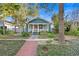 Craftsman home with landscaped yard, brick walkway, and a cozy front porch at 202 13Th N Ave, St Petersburg, FL 33701