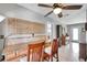 Kitchen counter with bar stool seating and open concept to living area and view of the entry at 2731 56Th N Ln, St Petersburg, FL 33710