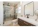 Bathroom featuring a walk-in shower, modern vanity, and minimalist decor at 2821 Coral Way, Punta Gorda, FL 33950