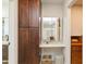 Bathroom vanity area with dark cabinets and a large mirror at 2821 Coral Way, Punta Gorda, FL 33950