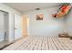 Bedroom features a closet, a wall with an art piece, and natural light from window at 2821 Coral Way, Punta Gorda, FL 33950